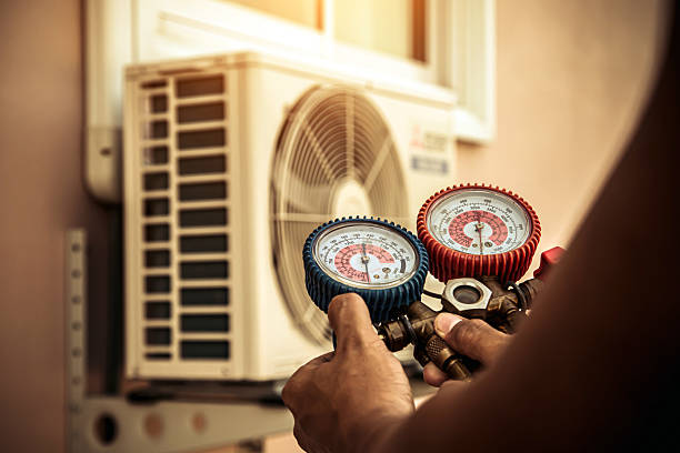 Professional Air Conditioning Service technician working in Hauppauge, NY